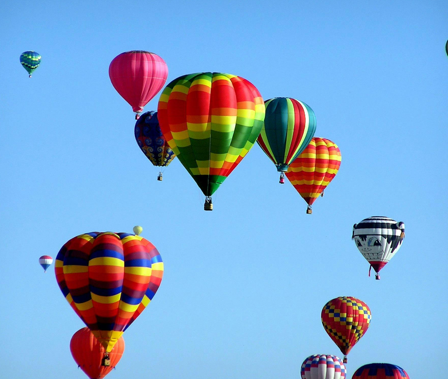 Colorful hot air balloons in a blue sky